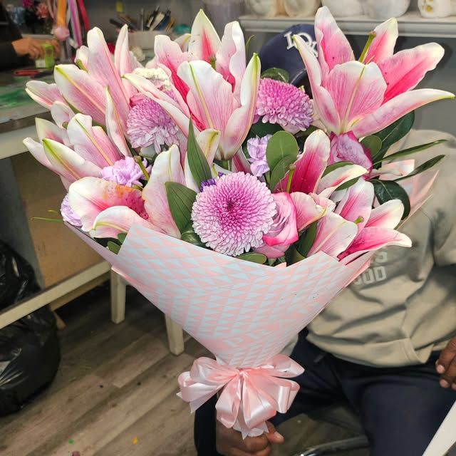 White lily sympathy bouquet arranged at House Of Petals 127